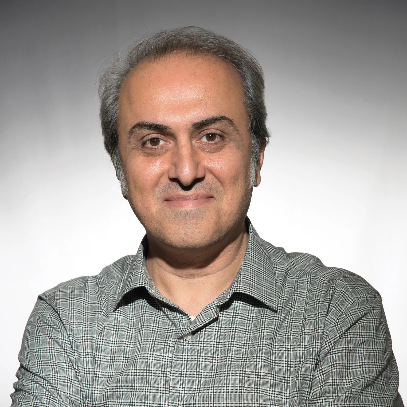 Headshot of a smiling man