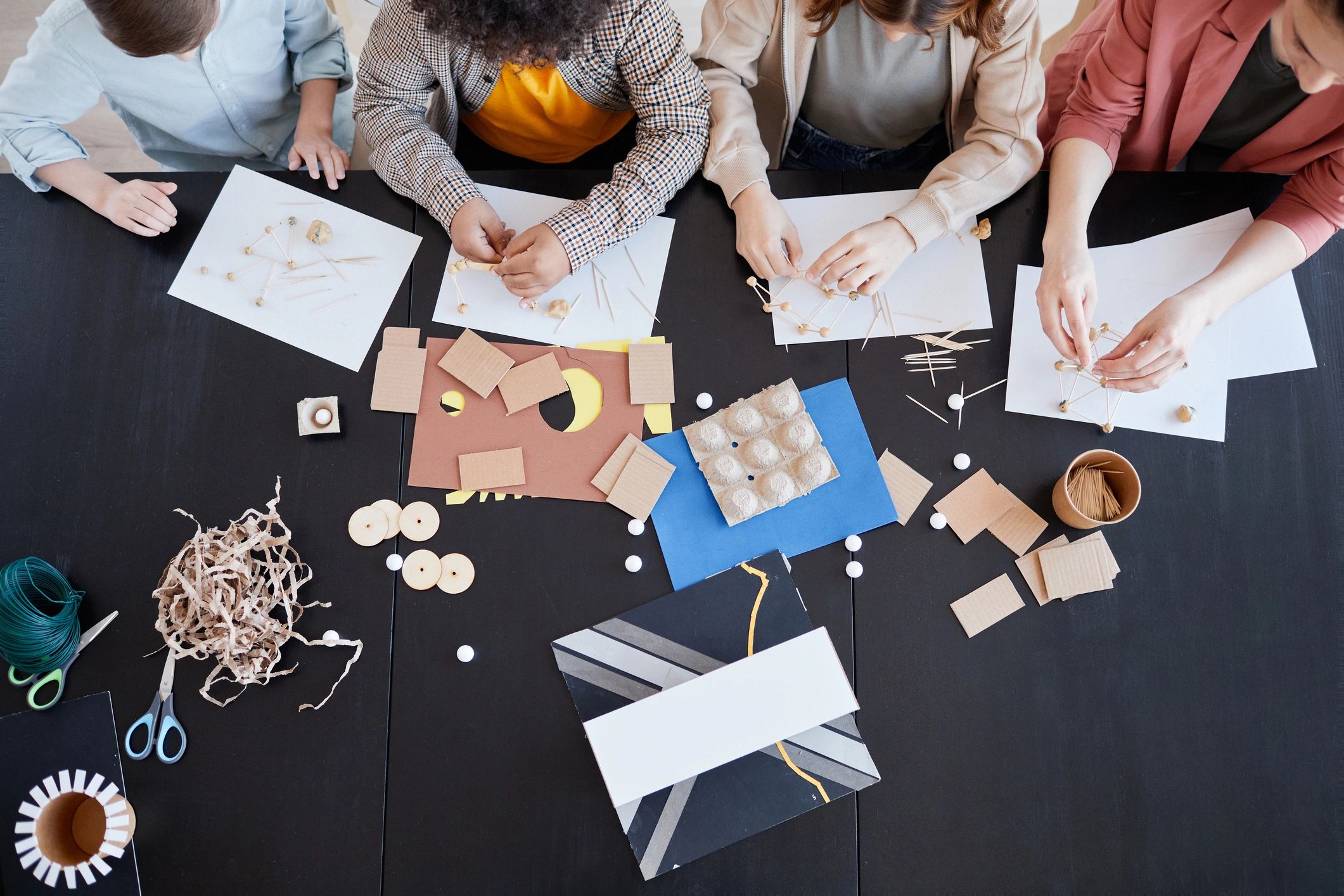 Top view of children doing arts and crafts in a classroom