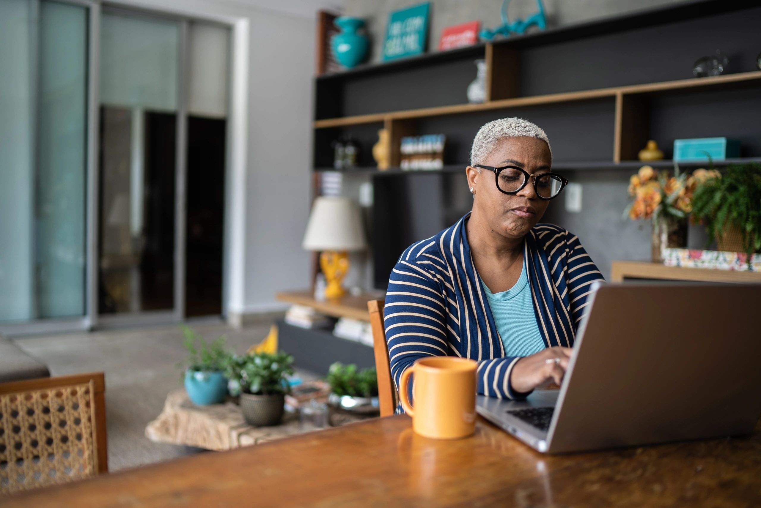 Adult learner working on a laptop