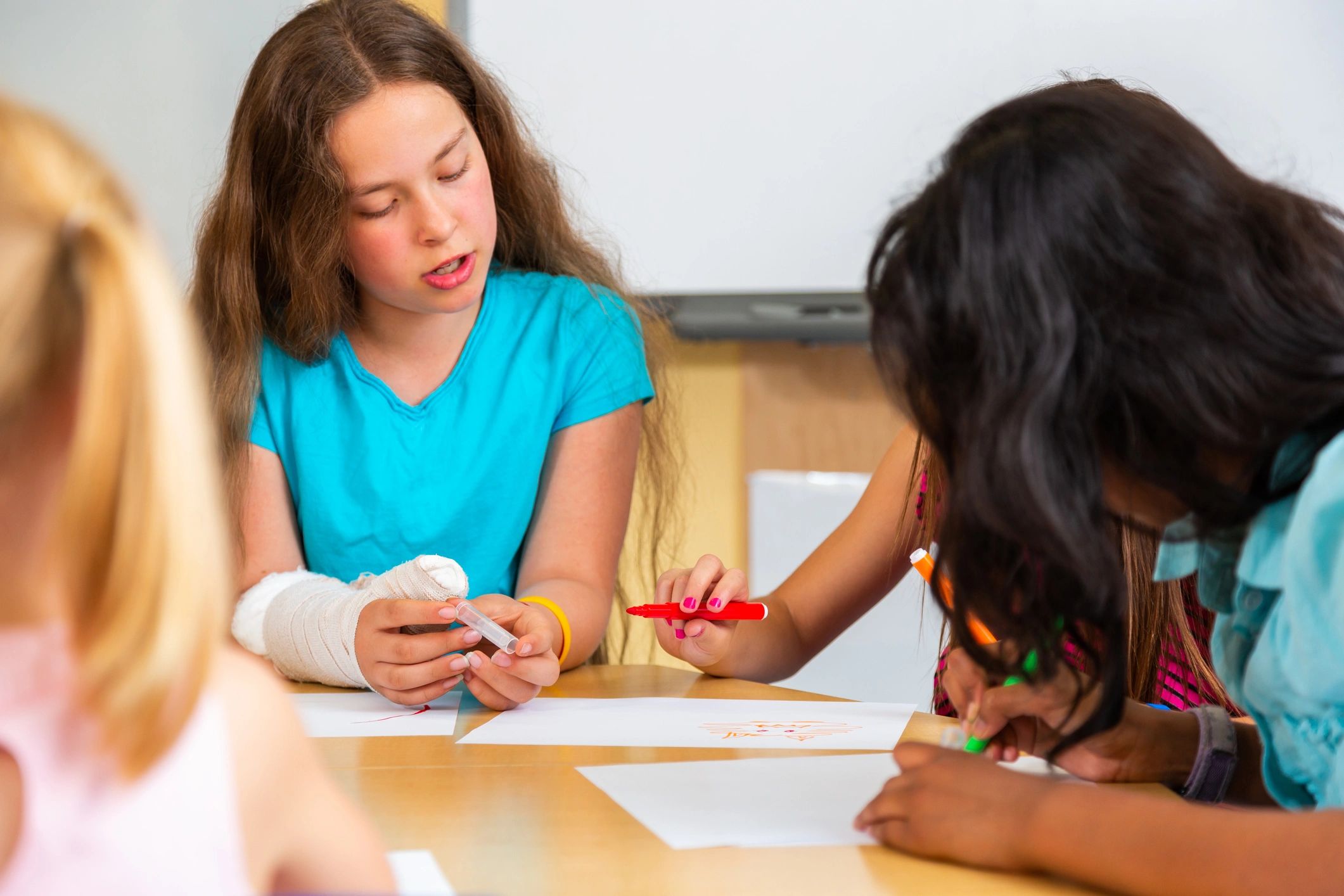 Students drawing together in a classroom creative workshop