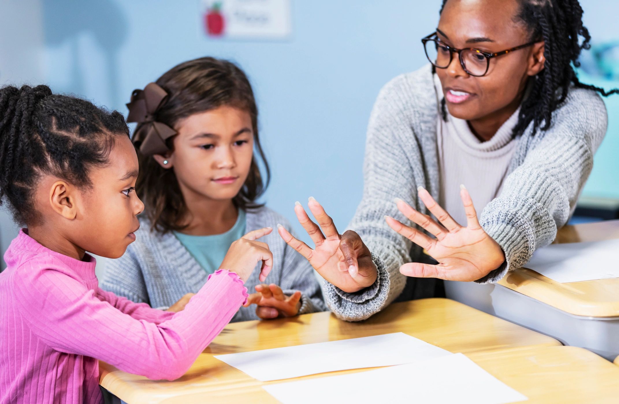 Teacher leading a small group math lesson in a classroom