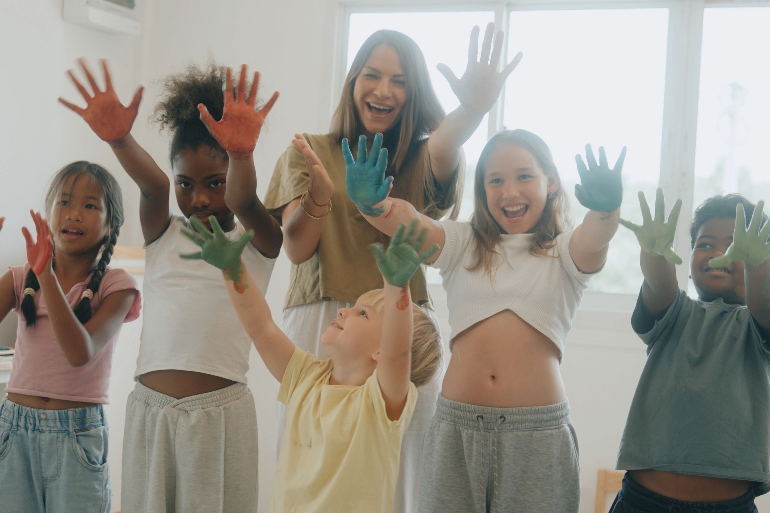 Teacher with students during an art class